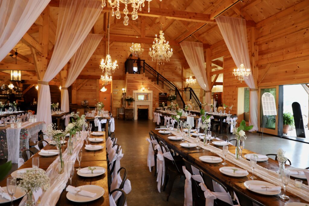 Wedding barn overlooking coastal meadow with elegant post and beam
